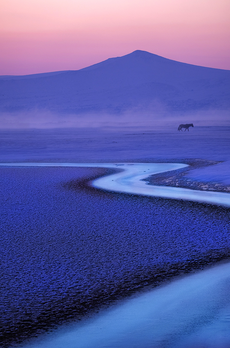Hüseyin Taskin, 'Harmony', a photograph of a sunset coming down on blue, atmospheric mountains. 