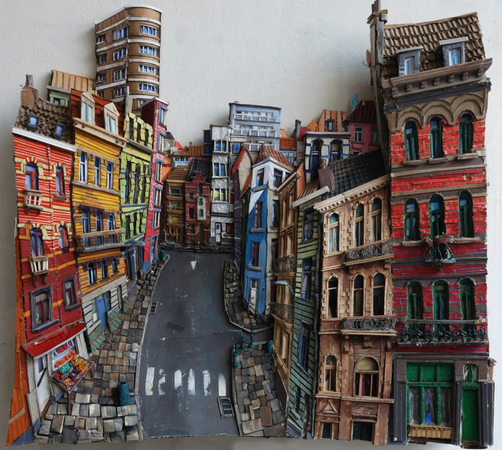 A colourful 2D recreation of a street in Brussels using cardboard and wood pieces. 