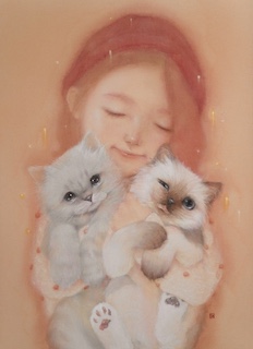 A girl hugging two cats.
