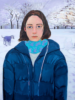 A lady wearing a blue jacket and a blue scarf. Her eyes are so big. 