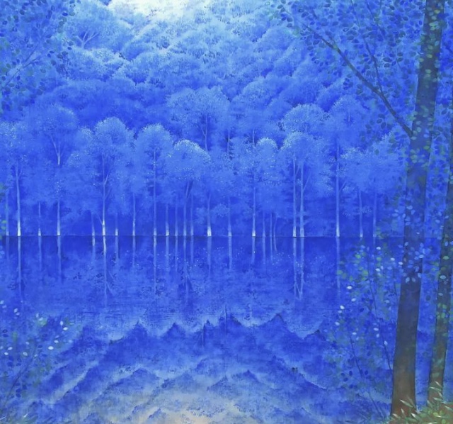 A blue forest. Reflection of the forest on the lake. 
