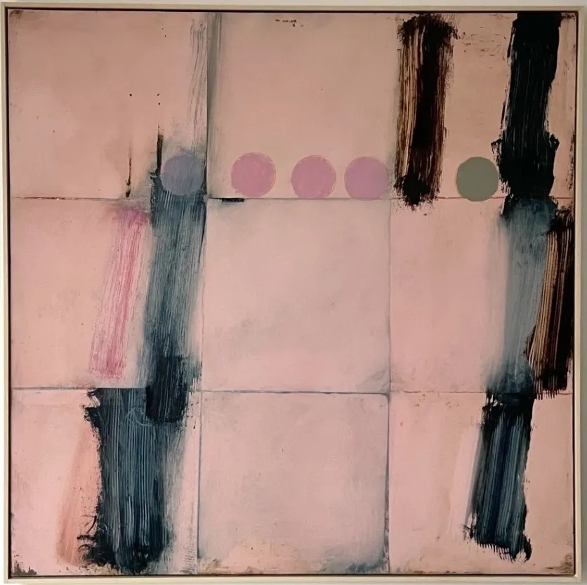 An abstract painting of nine pink squares, detailed with broad brown brush strokes and five circles in the top half. 