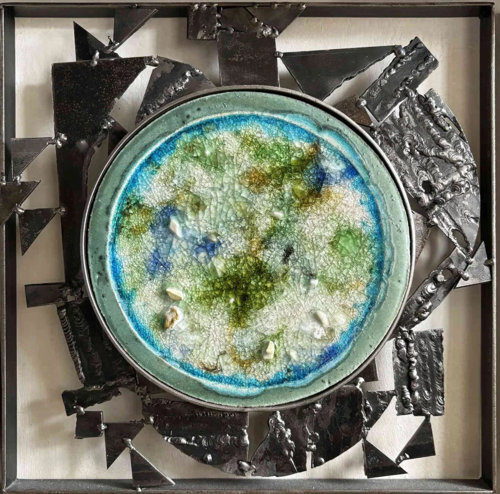 Wall art with blue hues, made out of recycled glass, ceramic and steel
